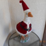 A duck dressed like Santa